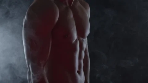Young fit man on black background Stock Footage 137211311