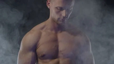 Young fit man on black background Stock Footage 137211376
