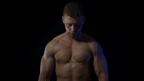 Young fit man on black background Stock Footage 137211573