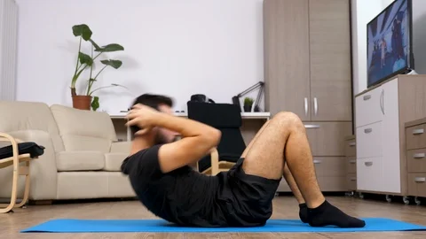 Young fit man doing ab exercises Stock Footage 95684464
