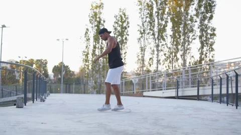 Young fit man doing breakdancing freeze move while dancing Stock-Footage 132070334
