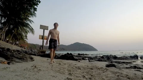 Young Fit Man Doing Frontflip at Beach Stock Footage 127917213