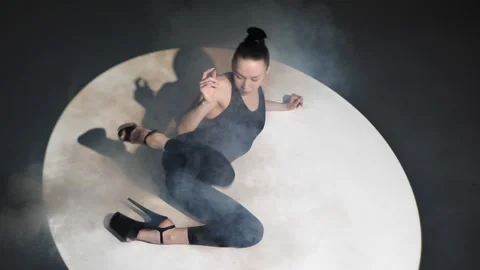 Young flexible dancer dancing isolated on dark studio background Video stock 240646719