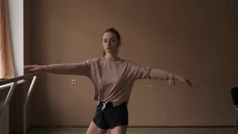 Young flexible female choreographer practicing contemporary dance elements at Video stock 84786421