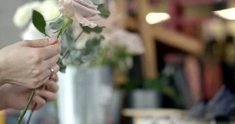 Young Florist Assembles a Bouquet Stock Footage 89518994