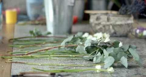 Young Florist Assembles a Bouquet Stock Footage 89882697