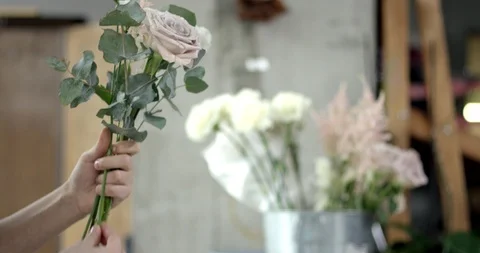 Young Florist Assembles a Bouquet Stock Footage 89882754