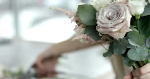 Young Florist Assembles a Rustic Wedding Bouquet Stock Footage 92081341