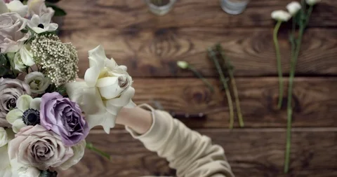 Young Florist Assembles a Rustic Wedding Bouquet Stock Footage 92083676