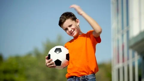 The Young Football Player Waves A Hand And Invites In A Game Stock Footage