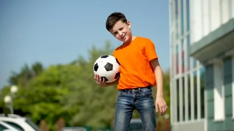 The Young Football Player Waves A Hand And Invites In A Game Stock Footage