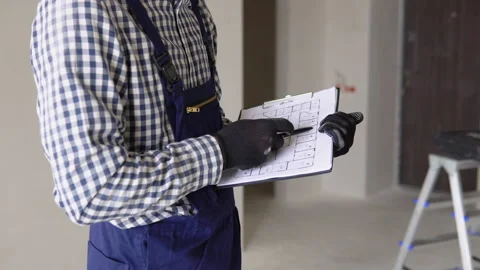 Young foreman builder, engineer or inspector checking and inspecting with Stock Footage 237763023