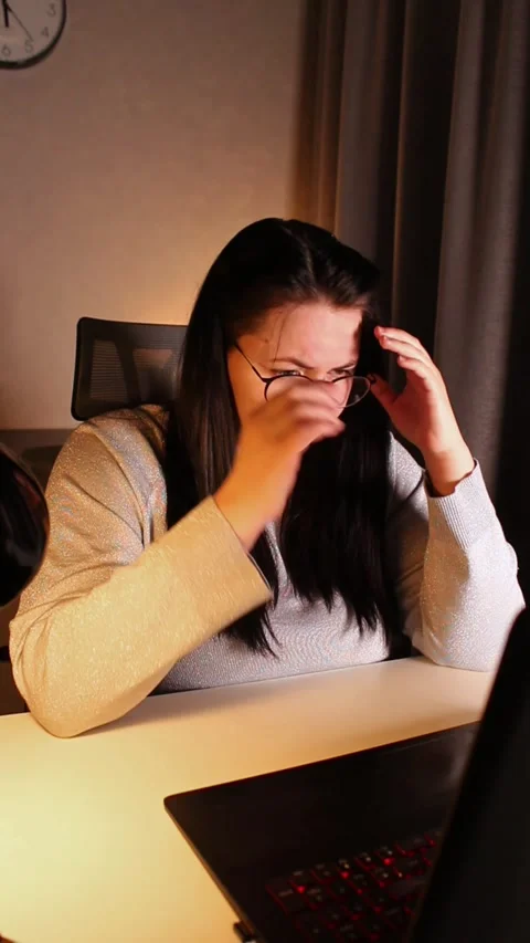 Young freelance accountant working remotely on laptop at home. Managing finance Stock Footage 307493589