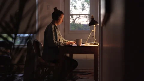 Young Freelance Woman sitting at Desk and Working From Home. Stock Footage