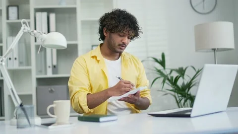 Young freelancer business man or student studies online via video call taking  Stock Footage 235482579