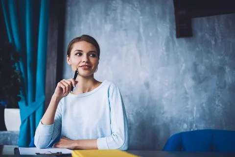 Young freelancer with documents in office Stock Photos