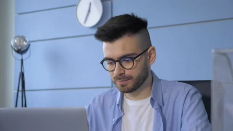 Young freelancer man working on computer at home. Casual entrepreneur Stock Footage 146318346