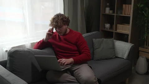 Young freelancer multitasking working from home on laptop Stock Footage 332430805