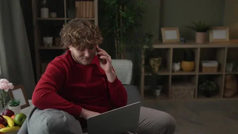 Young freelancer multitasking working from home on laptop Stock Footage 332430829