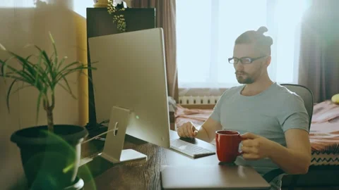 Young freelancer using computer to work using internet at home. Stock Footage 237451567