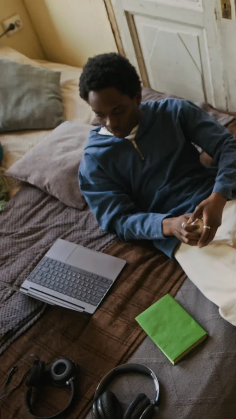 Young Freelancer Using Laptop and Throwing Baseball duirng Break at Home Stock Footage 334796839