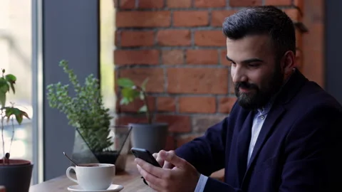 Young freelancer using mobile phone apps, texting message, browsing internet Stock Footage 171615178