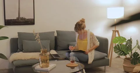 Young freelancer woman working on computer at home Stock Footage 143801626