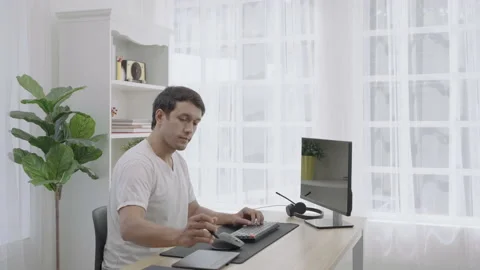 Young freelancer work at home with computer and using pen tool for work. Stock Footage 171047125