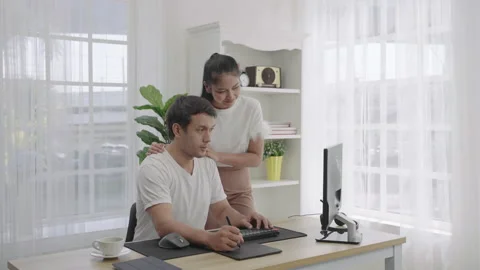 Young freelancer work at home with computer and using pen tool. Stock Footage 171049473