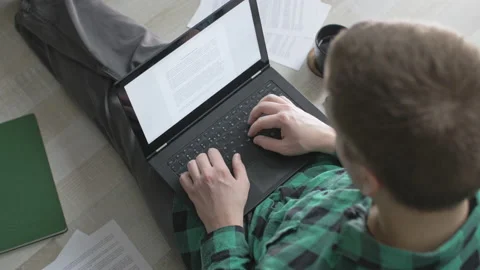 Young freelancer working and typing with his laptop from home Stock Footage 143092685