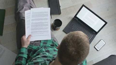 Young freelancer working and typing with his laptop from home Stock Footage 143096572
