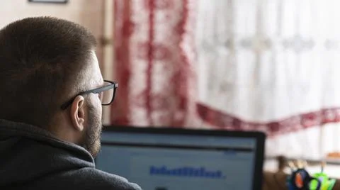 Young freelancer working at a computer at home Stock Photos