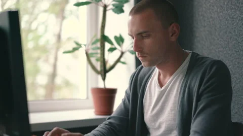Young freelancer working hard at a computer Stock Footage 63113014
