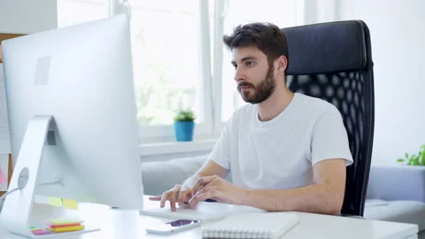 Young freelancer working from home with computer Stock Footage 142539137