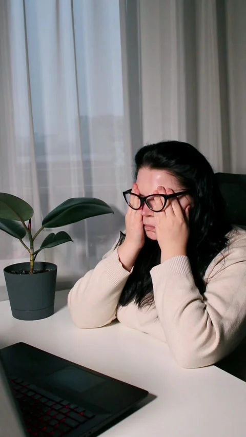Young freelancer working from home feeling tired after working whole day Stock Footage 303052422