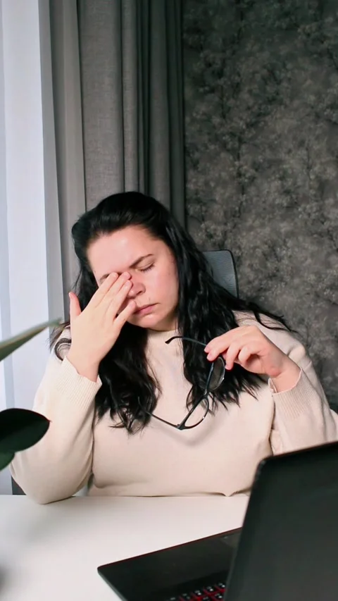 Young freelancer working from home feeling tired after working whole day Stock Footage 304039173