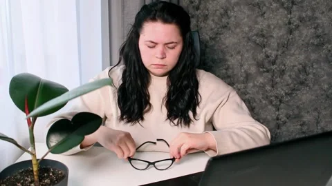 Young freelancer working from home feeling tired after working whole day Stock Footage 304039229