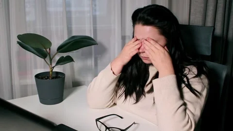 Young freelancer working from home feeling tired after working whole day Stock Footage 307752109