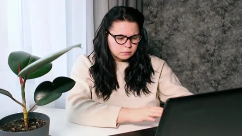 Young freelancer working from home feeling tired after working whole day Stock Footage 308014945