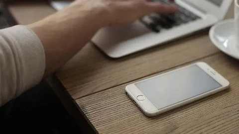 Young freelancer working on a macbook in cafe Stock Footage 74855351