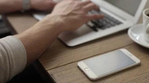 Young freelancer working on a macbook in cafe Stock Footage 74855357