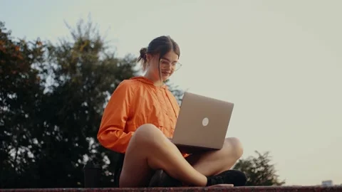 A young freelancer working on a new project on her laptop, concentrates on Video stock 164220063