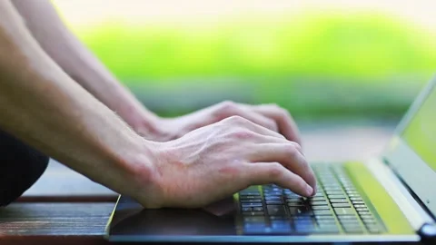 A young freelancer works in nature. Stock Footage 201824301