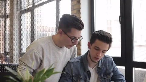 Young freelancers using notebook in the cafe for his work or plans Stock Footage 74855507
