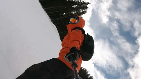 Young Freestyle Snowboarder practicing, holding camera self filming Stock Footage 146687522