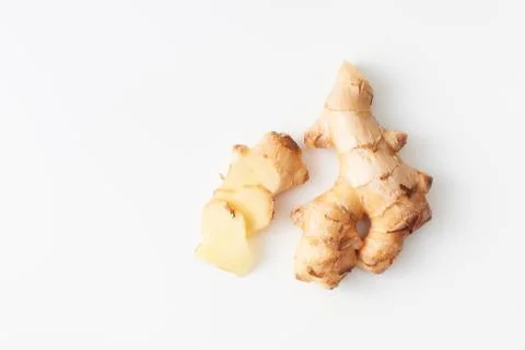 Young fresh cut ginger root on white background Stock Photos
