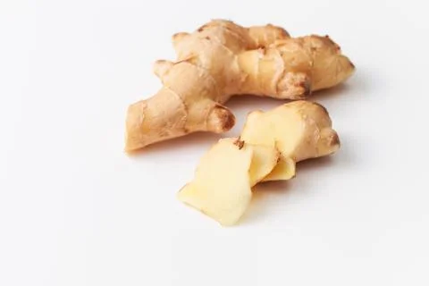 Young fresh cut ginger root on white background Stock Photos