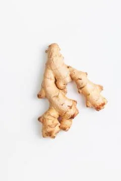Young fresh ginger root on white background Stock Photos