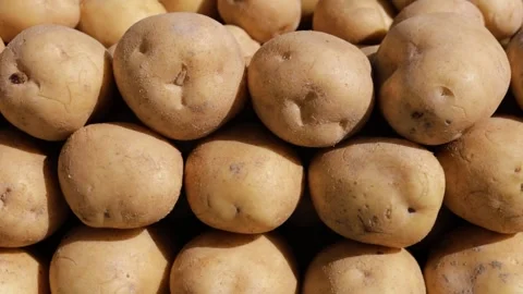 Young fresh potatoes on a bazaar counter Stock Footage 314065230