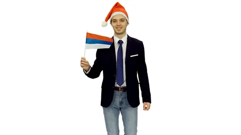 Young friendly guy moving forward with flag of Russia, alpha channel included Stock Footage 121560230